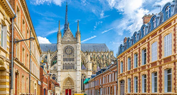 Amiens Cathedral Basilica of Our Lady Notre-Dame and pedestrian street with traditional buildings in old historical city centre, cityscape Amiens landmarks, Hauts-de-France Region, Northern France