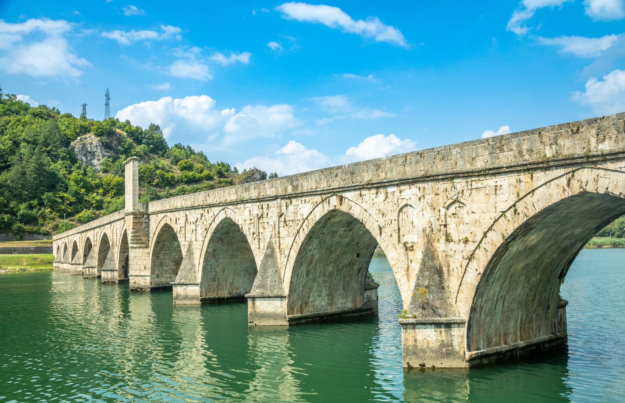 Photo of the Mehmed Pasa Sokolovic Bridge over the Drina River in Visegrad, Bosnia and Herzegovina.