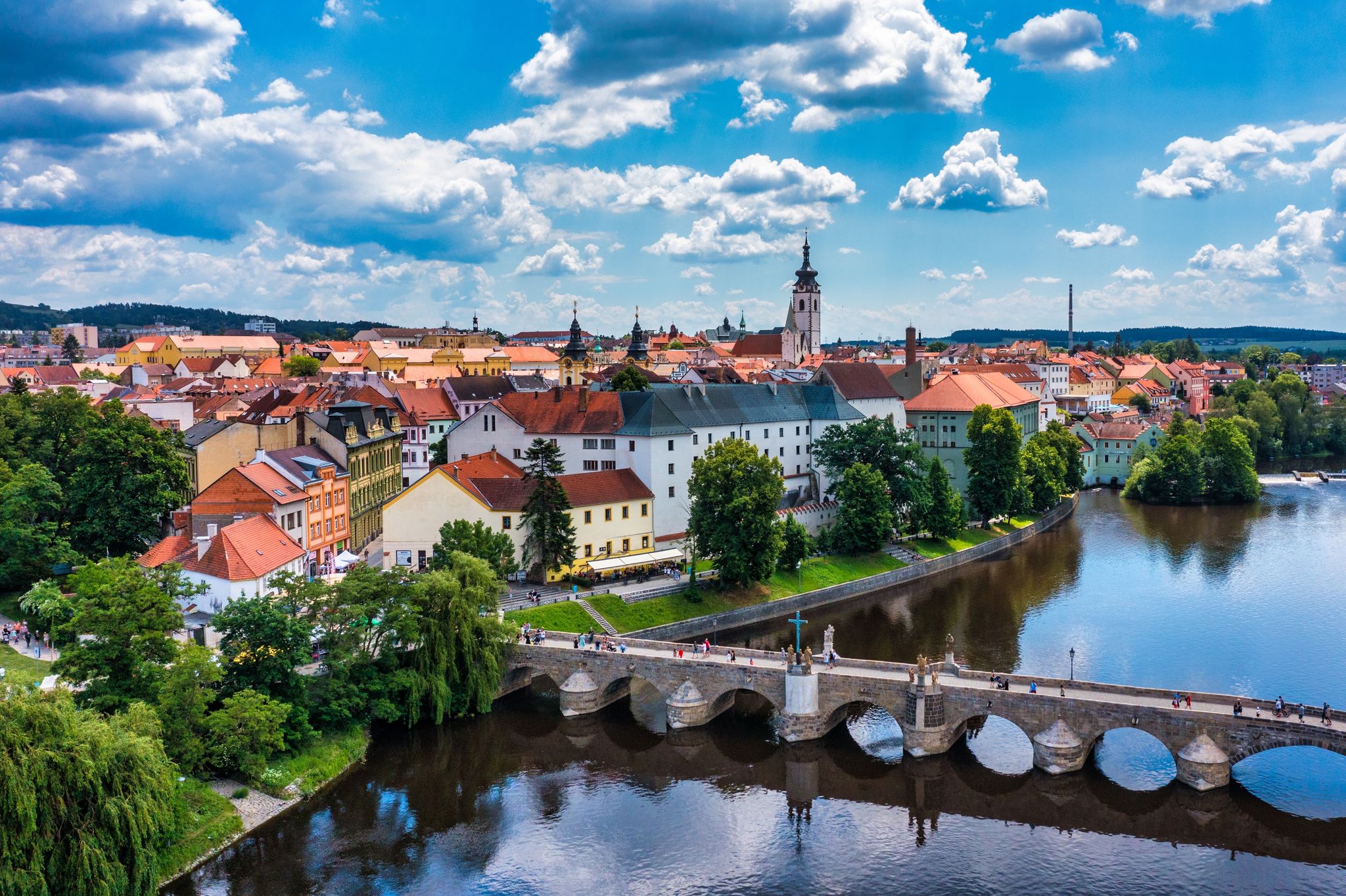 Photo of aerial view of Medieval Town Pisek and historic stone bridge over river Otava in the Southern Bohemia, Czech Republic.