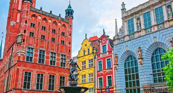 Neptune fountain at Main City Hall and Dlugi Targ Square in the old city center of Gdansk, Poland. People on the background.