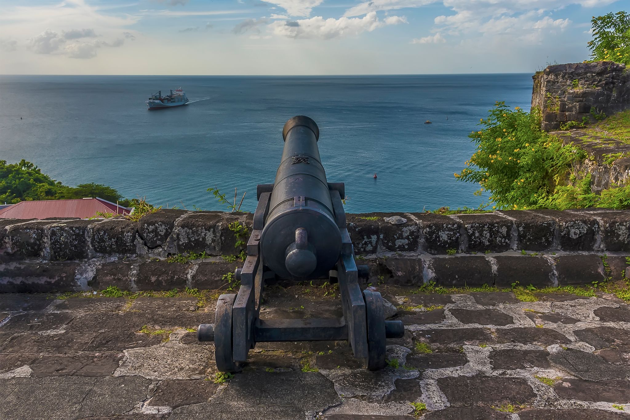 Photo of A view looking out to sea from Fort St George in Grenada .