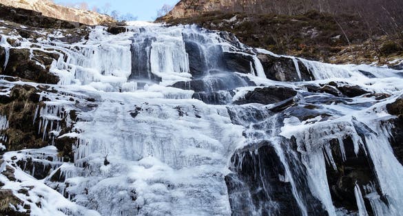 Photo of Creag Meagaidh mountain and Steall Waterfall in the scottish highlands of Scotland.