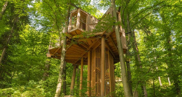 Modern tree house located in Celje town forest (Slovenia) near hiking path.