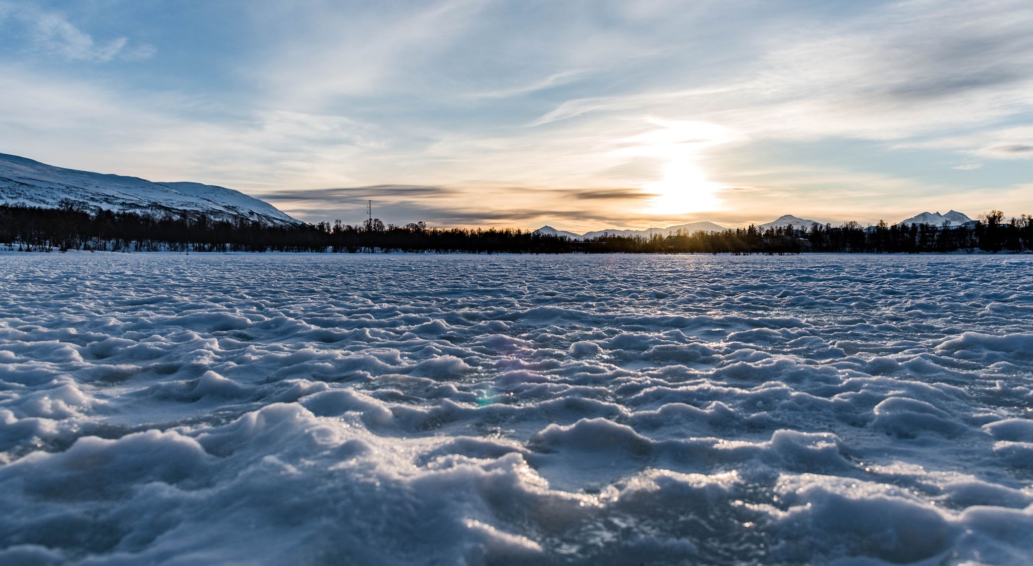 Sunset on the frozen lake of Tromsø