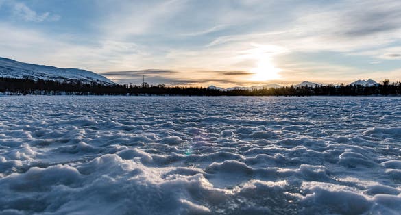 Sunset on the frozen lake of Tromsø