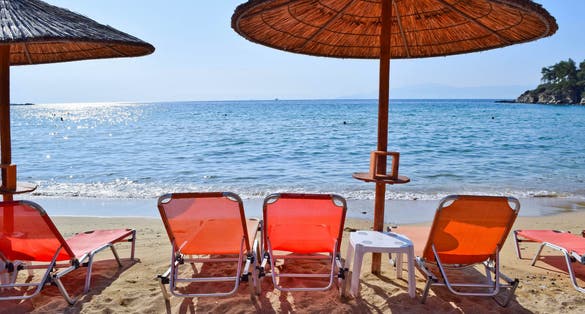 Photo of sun loungers on the beach in Kavala, Greece.