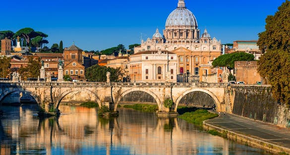  Vatican dome of San Pietro and Sant Angelo Bridge, over Tiber river in Rome, Italy.