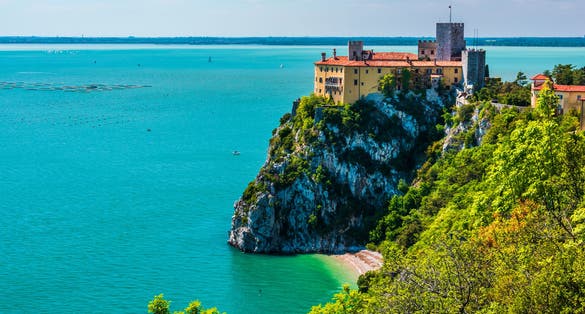 Gulf of Trieste. High cliffs Between boats, karst rocks and ancient castles. Duino. Italy.
