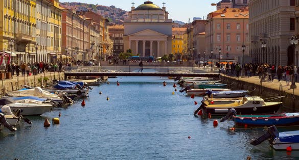 photo of view of Scenic view of the Canal Grande in Trieste, Italy bathing in the sun in a lazy summer day, Trieste, Italy.