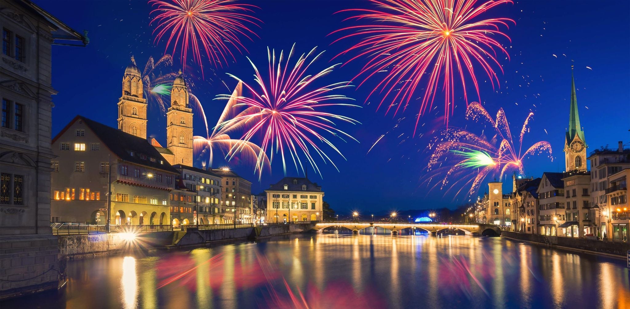 New Year’s Eve fireworks over Zurich’s historic city center and riverfront at night..jpg