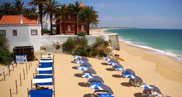 Photo of Armação de Pera beach in Algarve, Portugal.