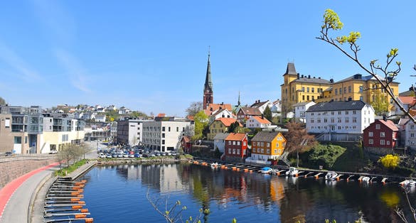 Sea view over the sea. Arendal city, Norway. city view, Arendal, Norway in the spring time on the nice sunny day. boats sit moored at the city habour With colorful house along the sea.