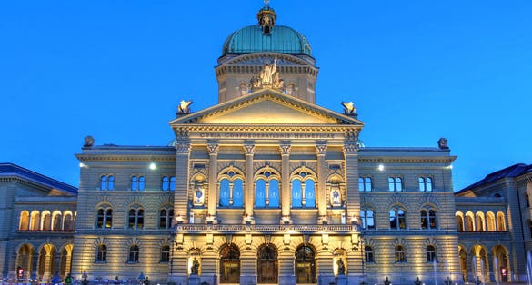 Photo of night view of the Federal Palace in Bern, Switzerland.