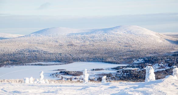 Photo of beautiful white winter of frozen lake, mountain at Ylläs Lapland, Finland.