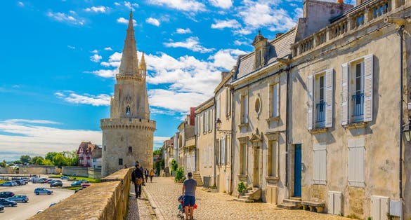 Photo of seaside of La Rochelle dominated by Tour de la Lanterne, France.