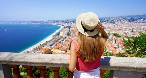 Photo of beautiful young woman enjoying the cityscape of Nice, French Riviera, France.