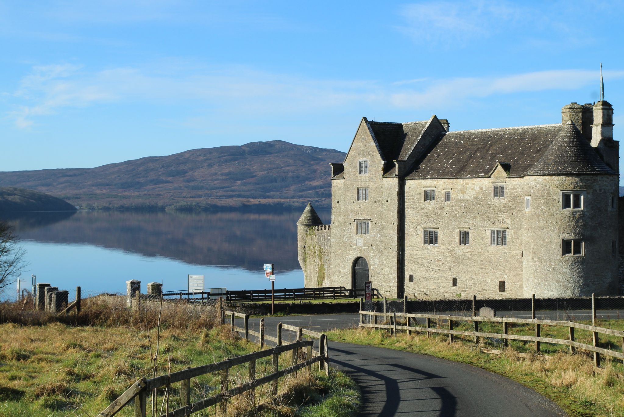 photo of Landscape at Kilmore, County Leitrim, Ireland featuring Parke's Castle, a 17th century castle on shores of Lough Gill with Killery Mountain in background .