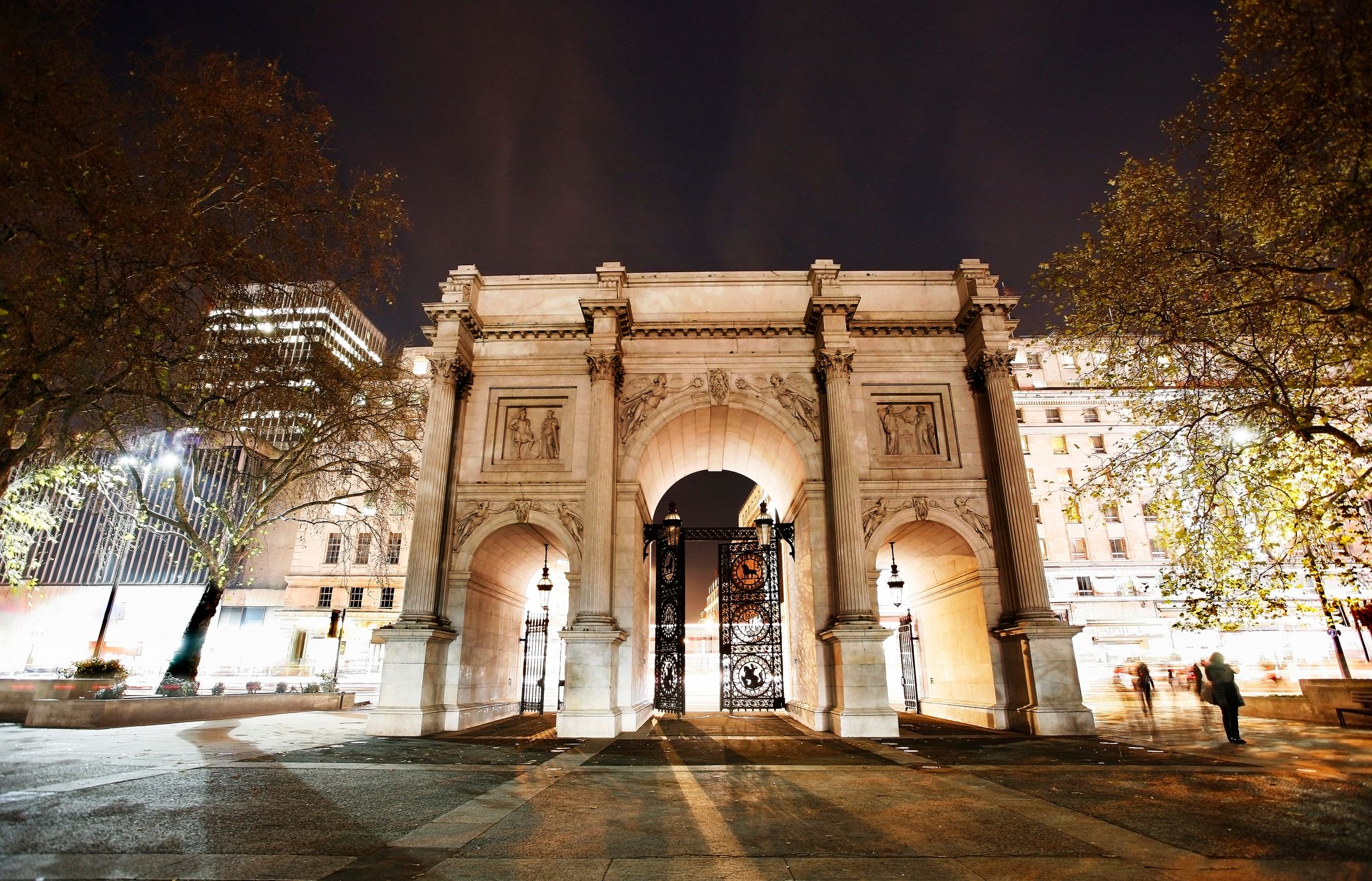 Photo of the Marble Arch at night, designed in 1825 by John Nash, completed in 1833, located in central London, UK.