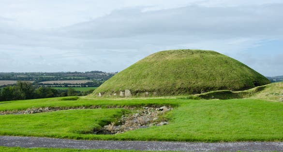 photo of view of Knowth Neolithic Passage Mound Tombs in Boyne Valley, Ireland.