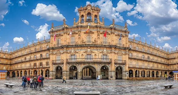 Photo of Famous and historic Plaza Mayor in Salamanca on a sunny day with dramatic clouds, Castilla y Leon, Spain