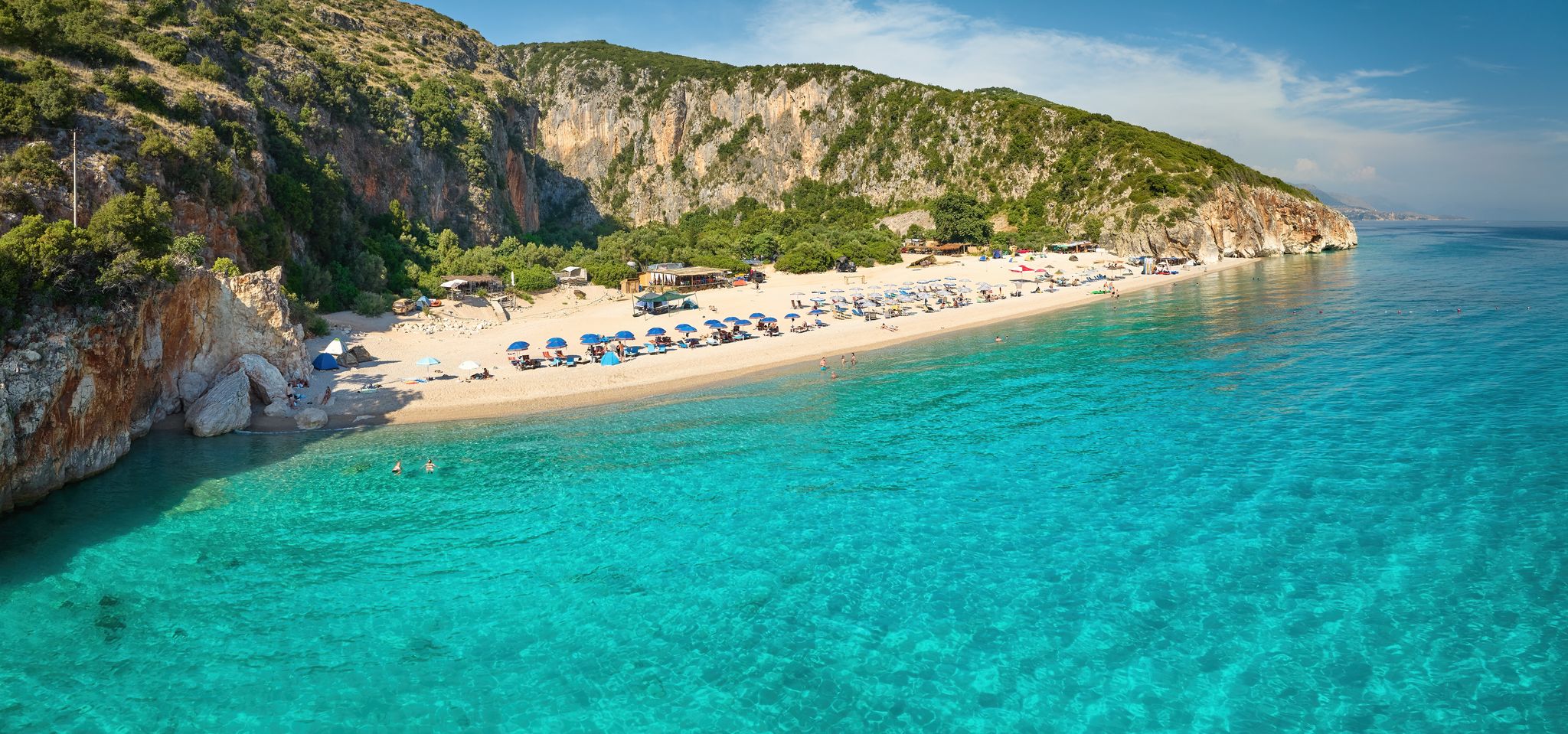 Photo of Gjipe beach, Clear waters of the Ionian Sea, impressive canyon, best beach in Albania.