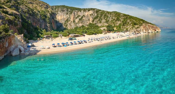 Photo of Gjipe beach, Clear waters of the Ionian Sea, impressive canyon, best beach in Albania.