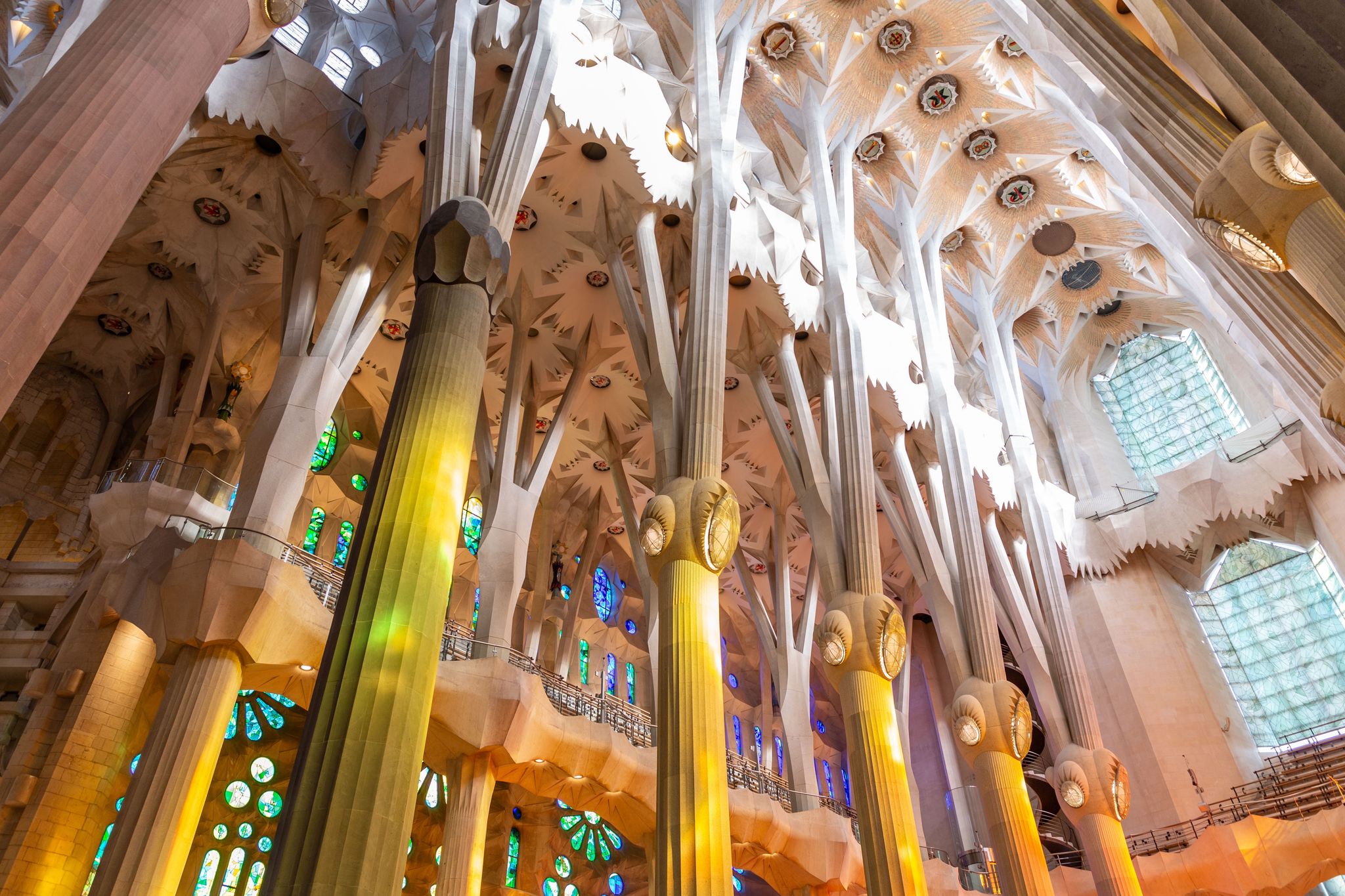 Photo of view from the astonishing interior of La Sagrada Familia, a large unfinished minor basilica in the Eixample district of Barcelona, Catalonia, Spain.