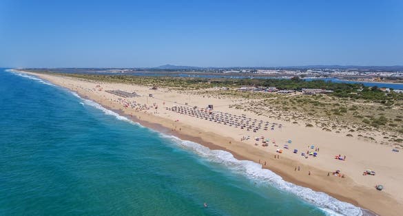 Aerial. Beach and tourists on the island Tavira. Algarve