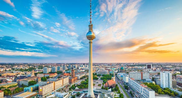 Photo of aerial view of Berlin skyline with famous TV tower at Alexanderplatz at sunset, Germany.