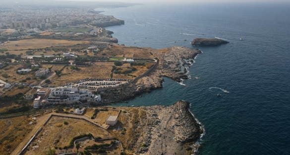 photo of  view of Aerial view of Cala Port'Alga near Torre Incina and Isola dell'Eremita in Polignano a Mare, in Puglia. Drone view of cliffs, coastline in Puglia and small island, near Monopoli, province of Bari.,Polignano a Mare Italy.