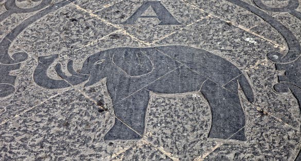 photo of view of Elephant logo on the marble pavement front Palazzo degli Elefanti - a symbol of the city - in Catania, Sicily, Italy.