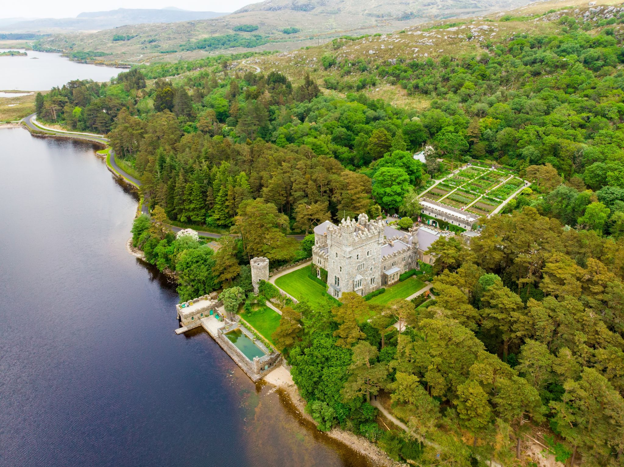 photo of Aerial view of Glenveagh Castle, a large castellated mansion located in Glenveagh National Park. Glenveagh National Park, the second largest national park in Ireland, County Donegal, Ireland .
