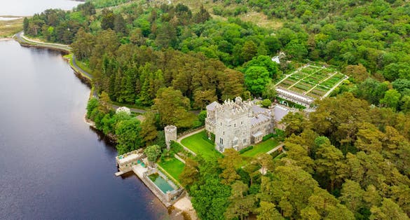 photo of Aerial view of Glenveagh Castle, a large castellated mansion located in Glenveagh National Park. Glenveagh National Park, the second largest national park in Ireland, County Donegal, Ireland .