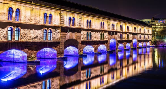 photo of night illumination of Barrage Vauban in Strasbourg, France.