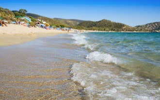 photo of an aerial view of Cagliari, in Sardinia, Italy, with the Montelargius lake and Quartu Sant Elena in the background.