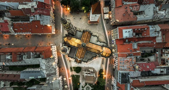 Bird view perspective on Kosice and cross from the golden roof of St Elisabeth's Cathedral.