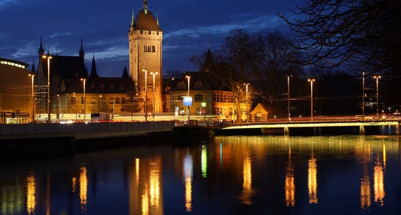 Photo of Swiss National Museum (Schweizerisches Landesmuseum) in Zurich at night, Switzerland.