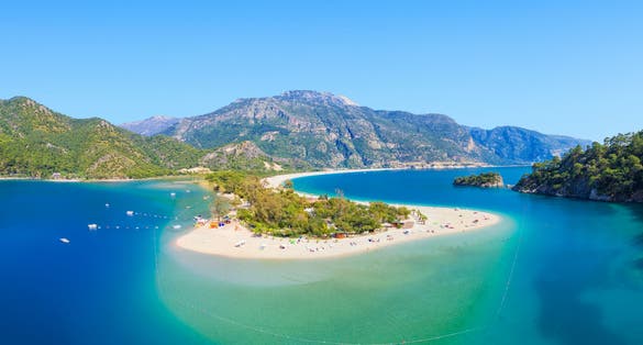 Photo of aerial view of blue lagoon and pebble beach in Oludeniz, Fethiye district, Turquoise Coast of southwestern Turkey.