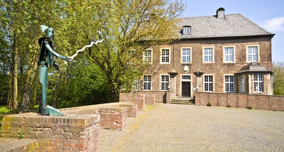 Photo of castle Vondern in Oberhausen on a sunny day, Germany.
