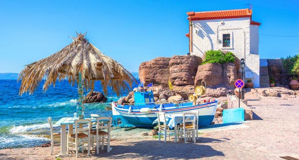 Photo of the little church of Panagia gorgona situated on a rock , seaside village of Lesvos