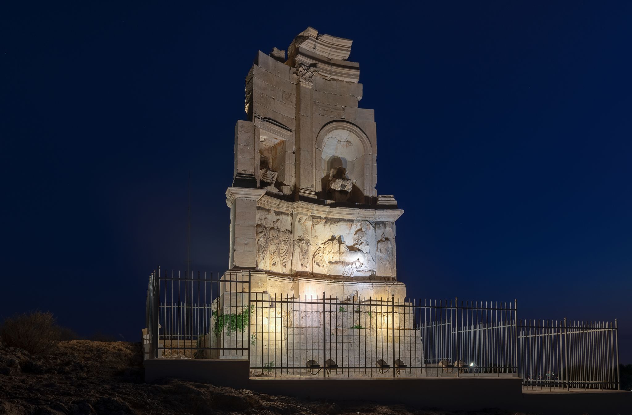 photo of viewof Philopappos Monument at Filopappou hill at night, Athens, Greece.
