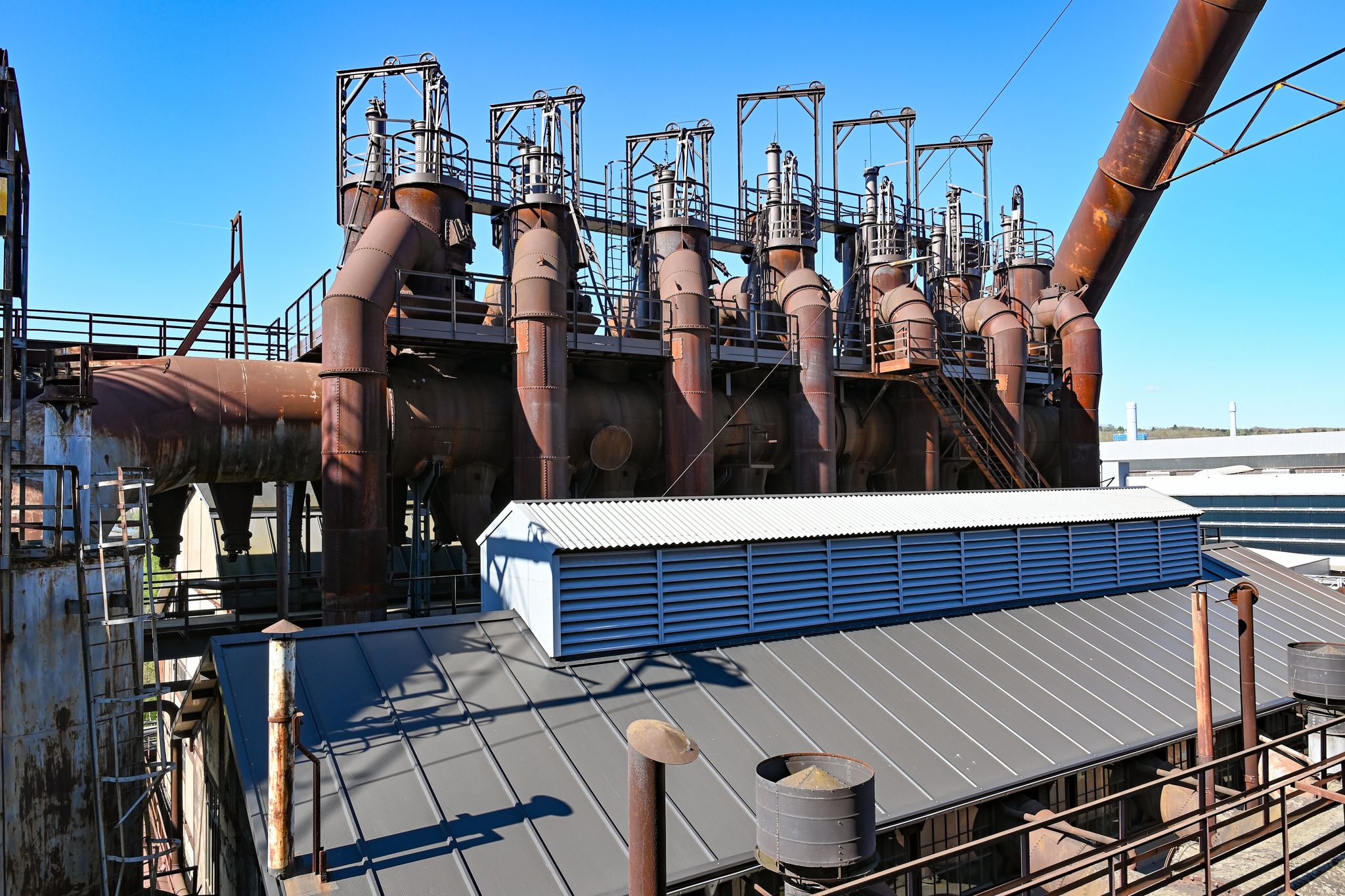 photo of Blast furnaces of the Völklingen Ironworks World Heritage Site with a blue sky, Völklingen, Saarland, Germany,Völklingen germany.