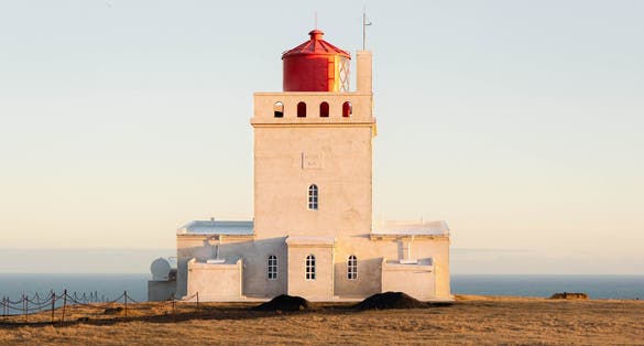 photo of dyrhólaey is the best place in the south of Iceland to spot puffins. On the top of the hill you spot this little lighthouse. Enjoy the spectacular views of black beach and the volcanic arch.