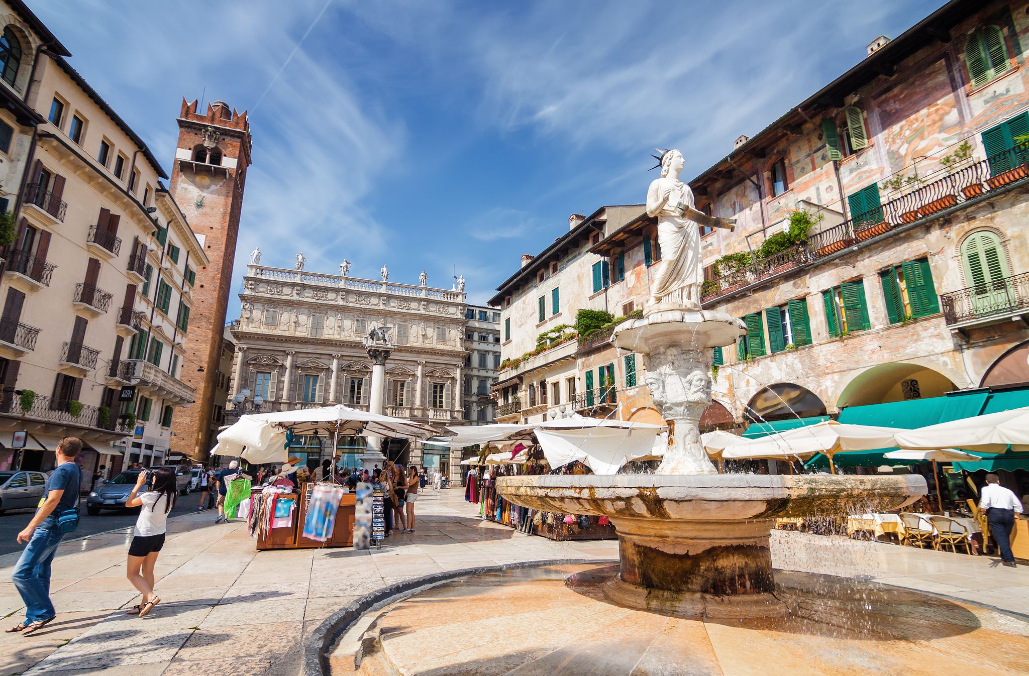 PHOTO OF Sunny view of the Piazza delle Erbe, palazzo Maffei and Gardello tower at historical center of Verona, Veneto region, Italy.