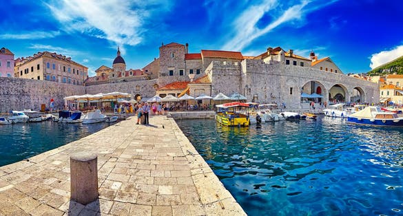 Photo of the Amazing panorama Dubrovnik Old Town roofs at sunset.