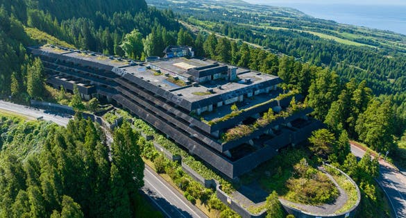 Photo of Aerial shot picturesque paradise of Sete Cidades in Azores, Sao Miguel. Volcanic craters and stunning lakes with abandoned Monte Palace hotel Ponta Delgada on hilltop, Portugal.
