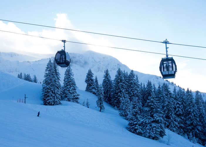 Photo of Cabin ski lift over a ski piste, Damüls ,Austria.
