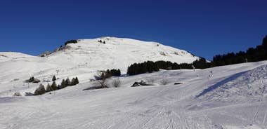 photo of Annecy city center panoramic aerial view with the old town, castle, Thiou river and mountains surrounding the lake, beautiful summer vacation tourism destination in France, Europe.