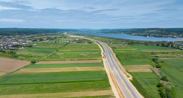 Highways under construction of Romania. Aerial view of A1 Bucuresti Pitesti Curtea de Arges Sibiu highway during construction. High speed roads infrastructure industry.