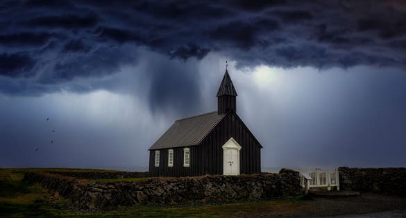 photo of view of The church is located on the southern side of the Snaefellsness peninsula. Iceland.